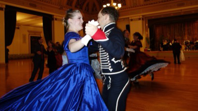 Elegantly dressed couples in Victorian formal attire